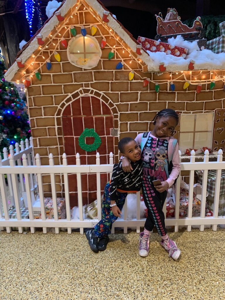Standing in front of the gingerbread house at Kalahari 