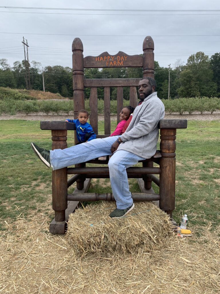 Sitting on the big chair at happy day farm